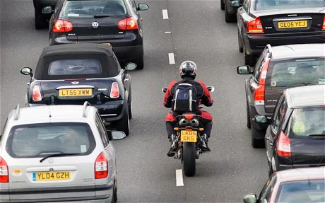 Image result for motorbike in traffic